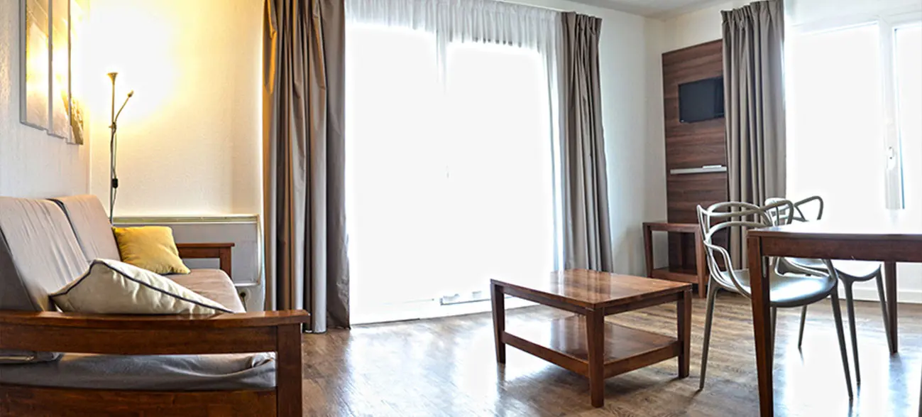 Salon dans un appartement d'une résidence hôtel à Aix Les Bains